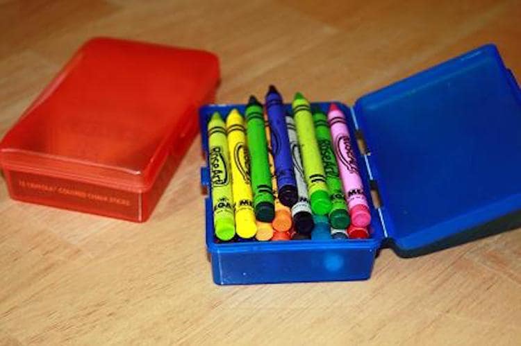 A travel soap container is the perfect size for a small set of crayons and easier to store than the crayon box.
