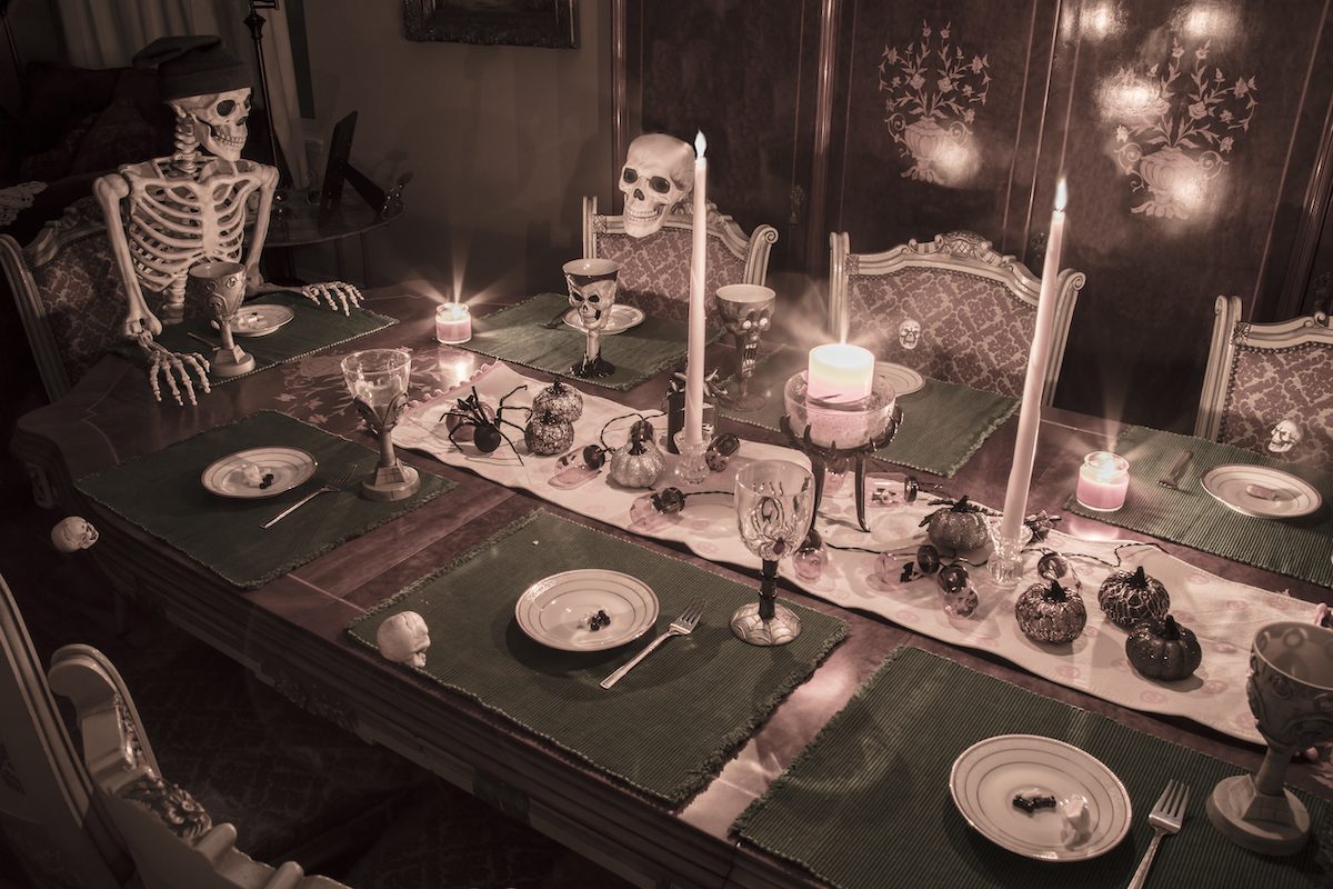 skeletons at dinner table