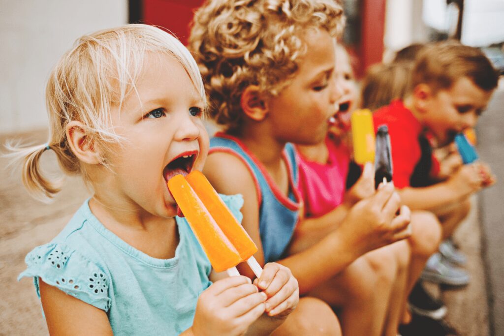 Group of kids enjoying popsicles
