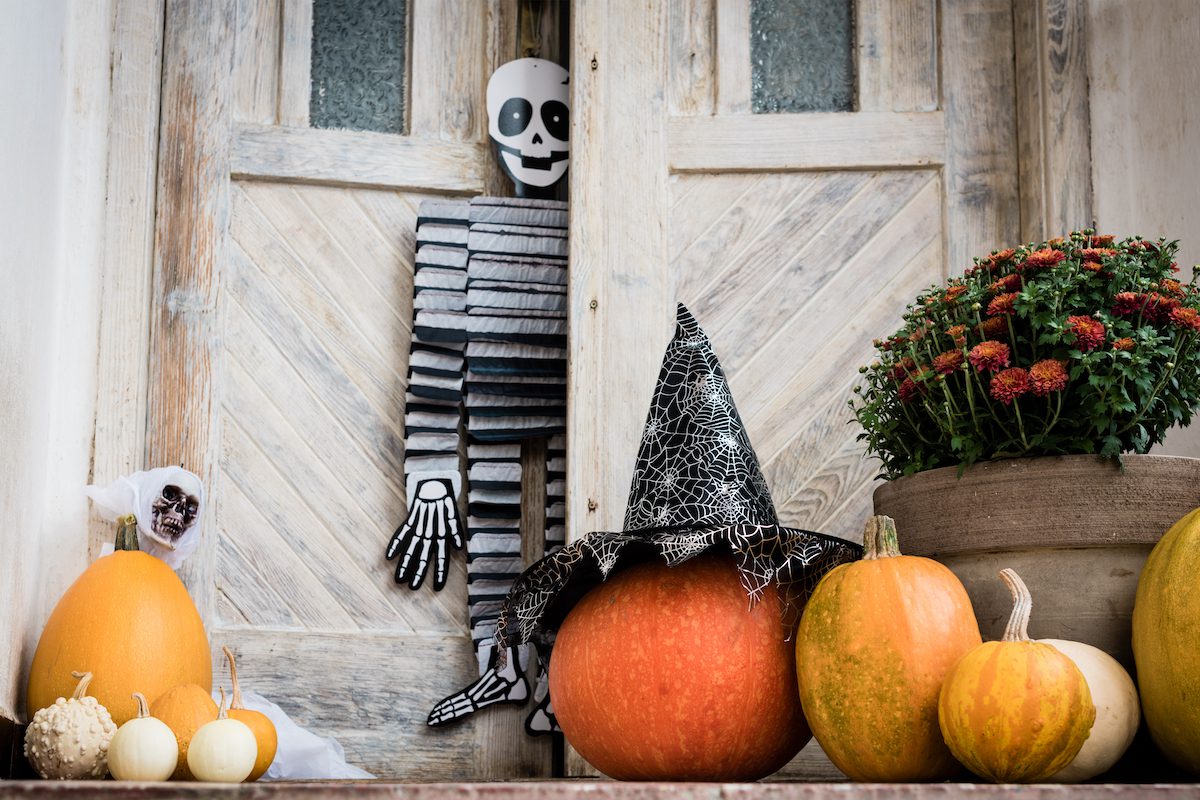 Front porch decorated with skulls and jack o lanterns