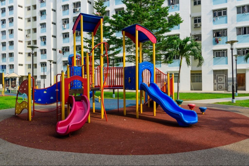 Apartment complex caters to children with a playground.